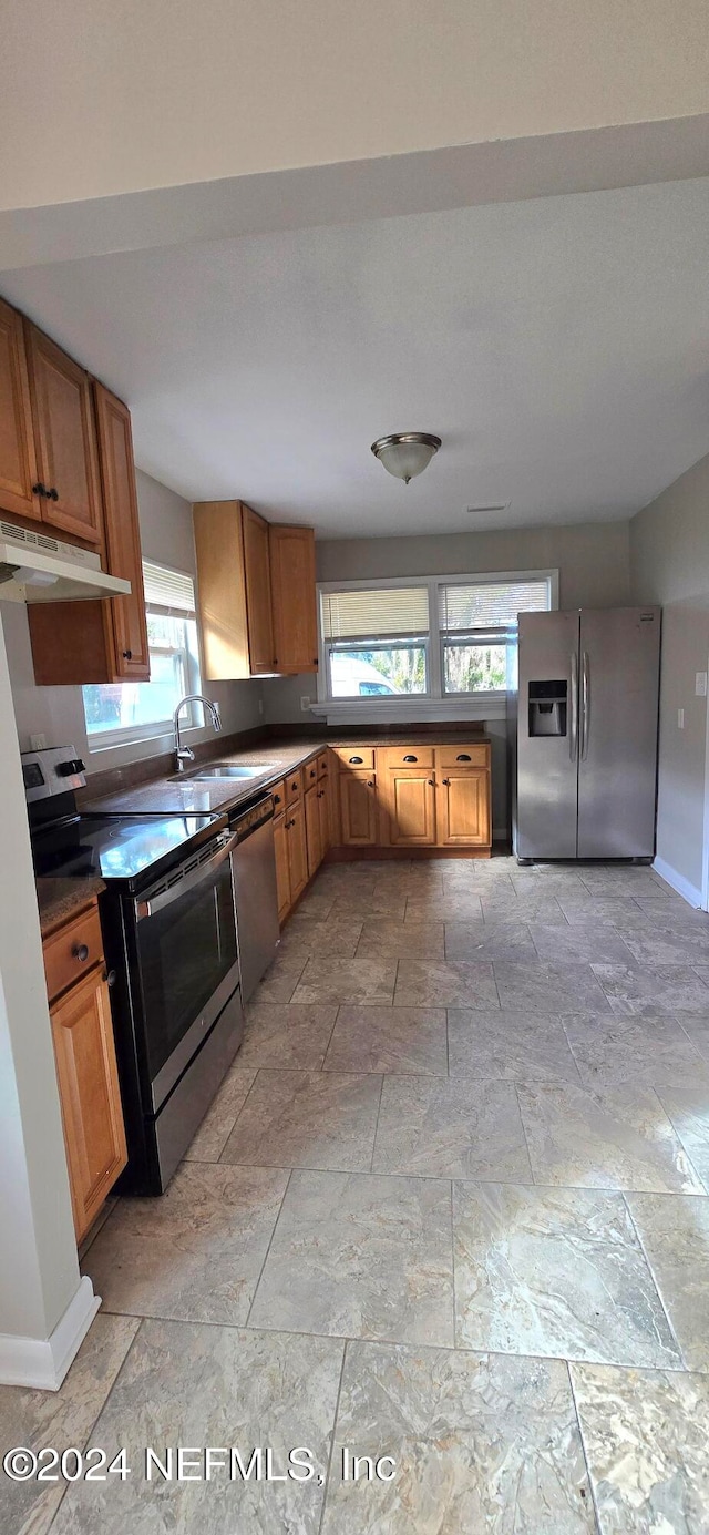 kitchen featuring appliances with stainless steel finishes and sink