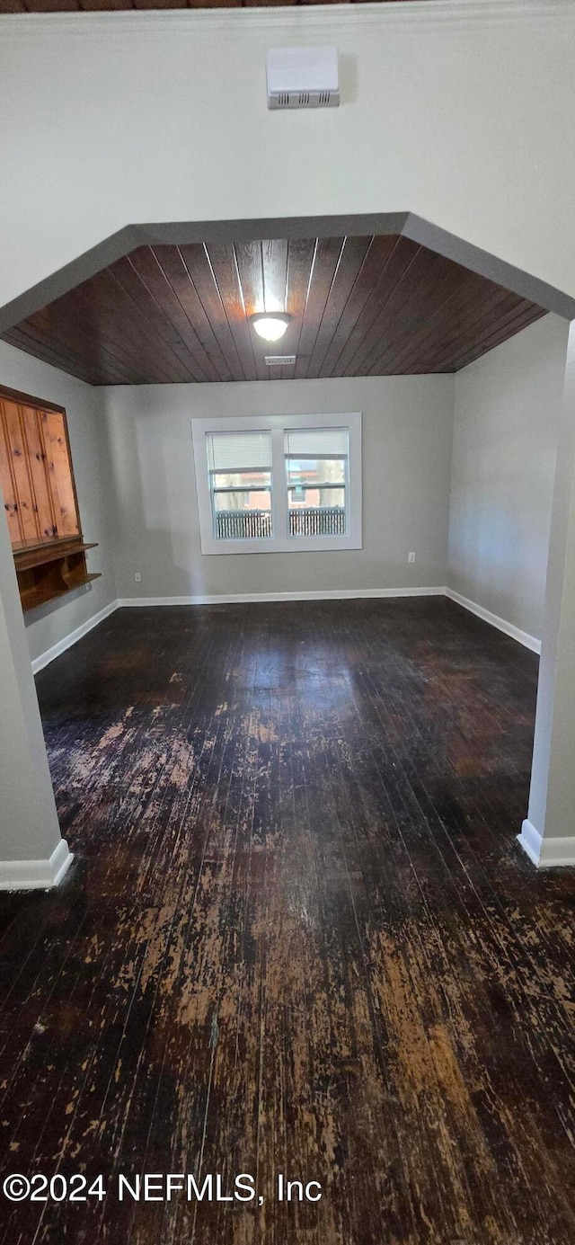 interior space with wooden ceiling and dark wood-type flooring