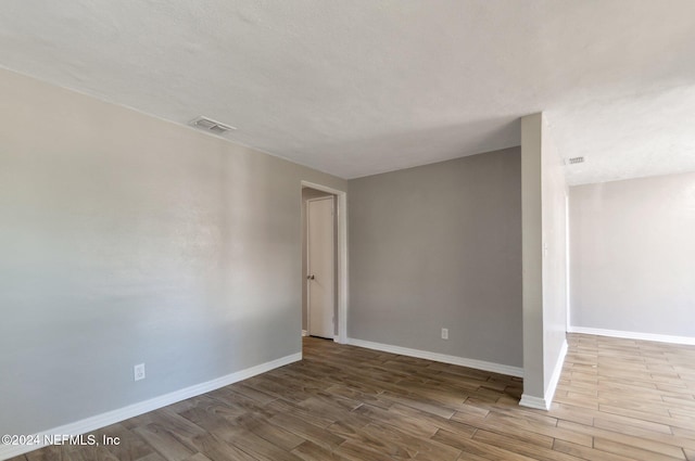 1526 W 14th St, Jacksonville, FL 32209 - spare room featuring baseboards, visible vents, and wood finished floors