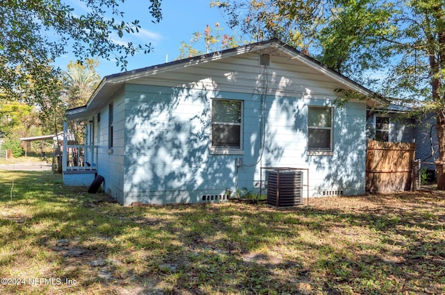 1526 W 14th St, Jacksonville, FL 32209 - exterior space with a yard, cooling unit, and crawl space