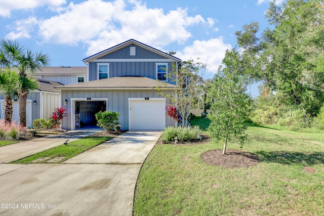 view of front of house featuring a front yard and a garage