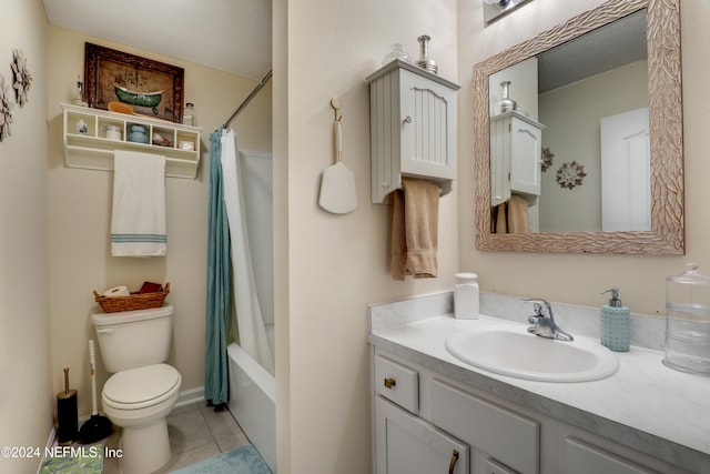 full bathroom with vanity, shower / bath combo with shower curtain, toilet, and tile patterned flooring