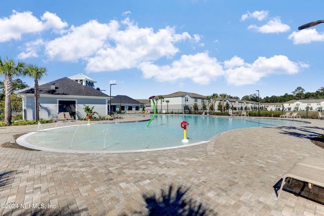 view of swimming pool featuring a patio