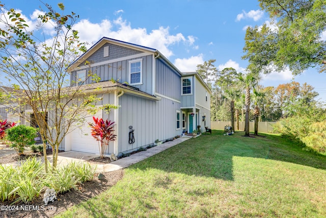 exterior space featuring a lawn and a garage