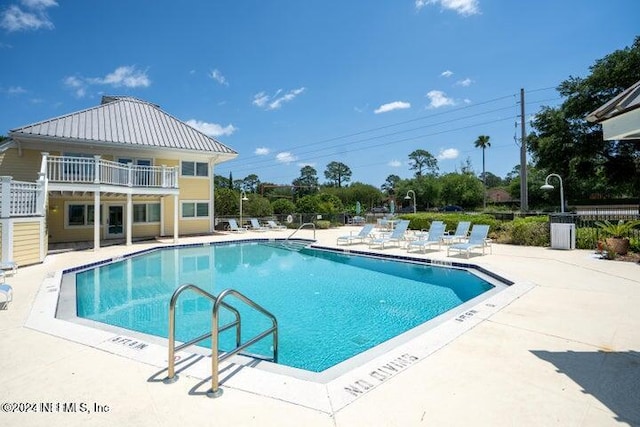 view of pool featuring a patio area