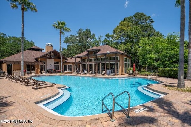 view of pool featuring a patio area