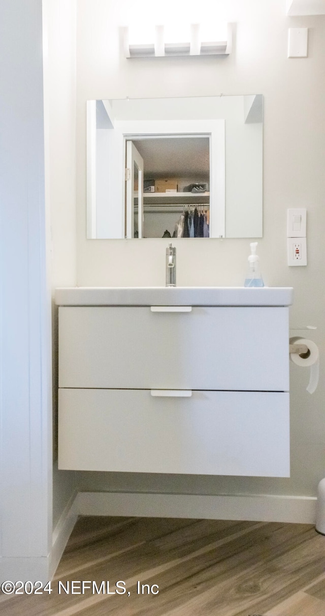 bathroom featuring hardwood / wood-style floors and vanity