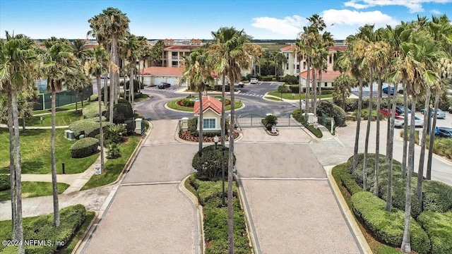 view of property's community with driveway and a residential view