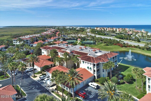 bird's eye view featuring a water view and a residential view