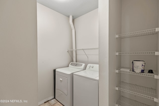 laundry area with independent washer and dryer