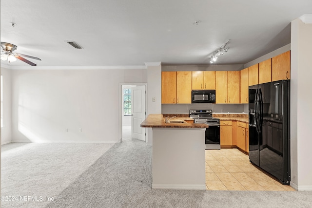 kitchen with black appliances, kitchen peninsula, ornamental molding, track lighting, and light colored carpet