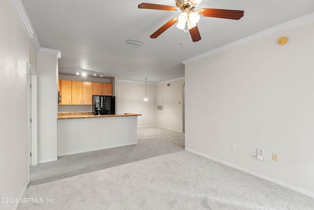 unfurnished living room featuring crown molding, light colored carpet, and ceiling fan