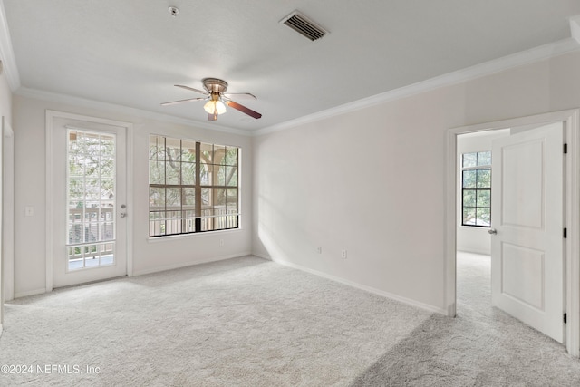 unfurnished room featuring plenty of natural light and light colored carpet