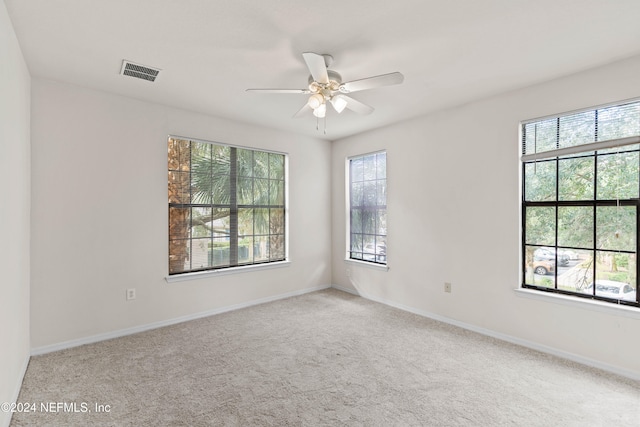 empty room with light carpet and ceiling fan