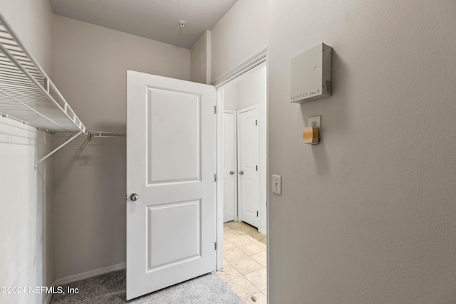 walk in closet featuring light tile patterned floors