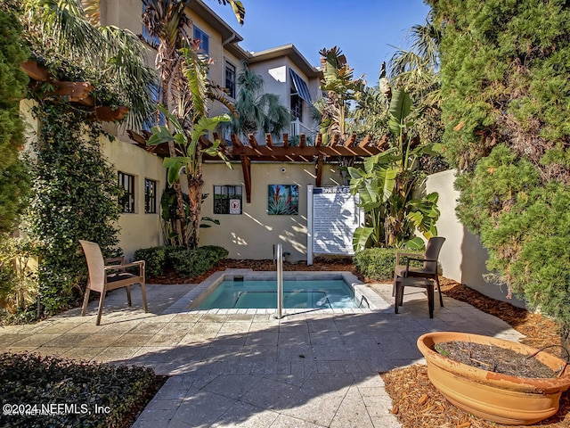 view of swimming pool featuring a patio and a pergola