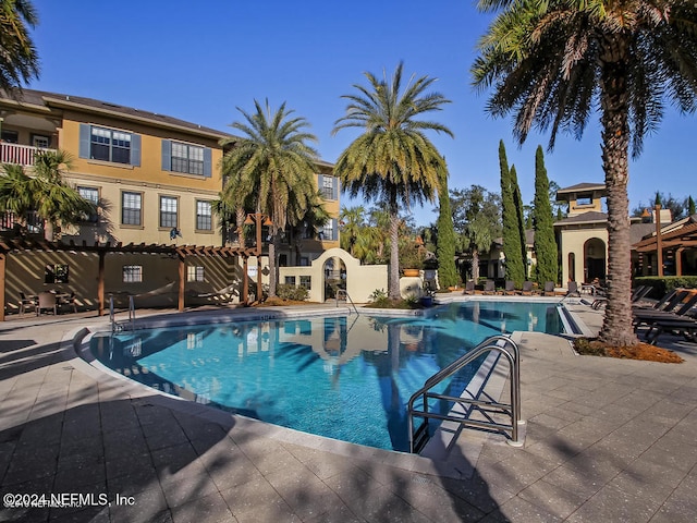 view of pool featuring a patio area