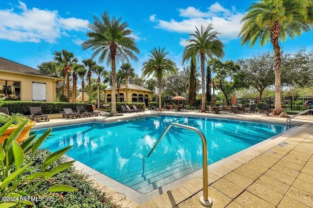 view of swimming pool featuring a patio