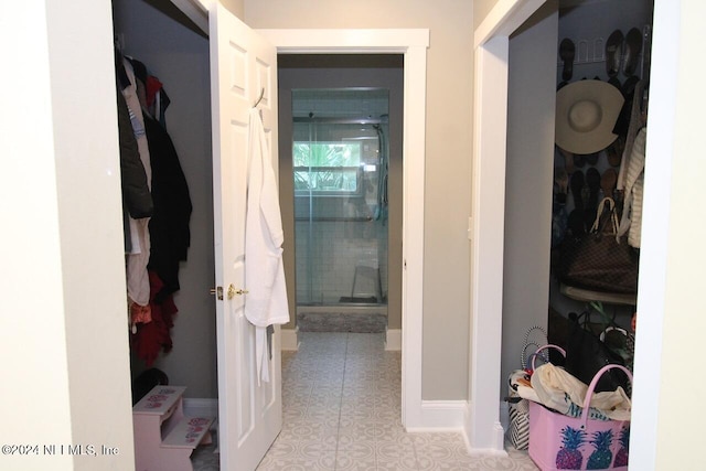 corridor featuring light tile patterned floors