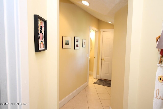 hallway with light tile patterned floors