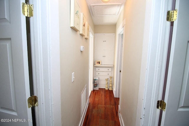 corridor featuring dark hardwood / wood-style flooring