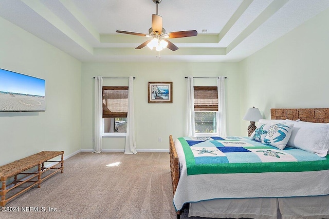 136 Pescado Dr, Saint Augustine, FL 32095 - bedroom with a tray ceiling, carpet, baseboards, and ceiling fan