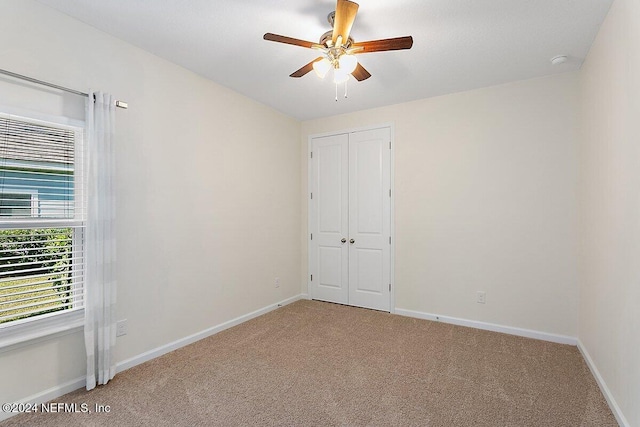 136 Pescado Dr, Saint Augustine, FL 32095 - empty room with carpet floors, ceiling fan, and baseboards