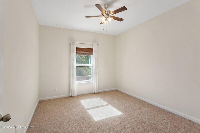 136 Pescado Dr, Saint Augustine, FL 32095 - spare room featuring carpet, ceiling fan, and baseboards