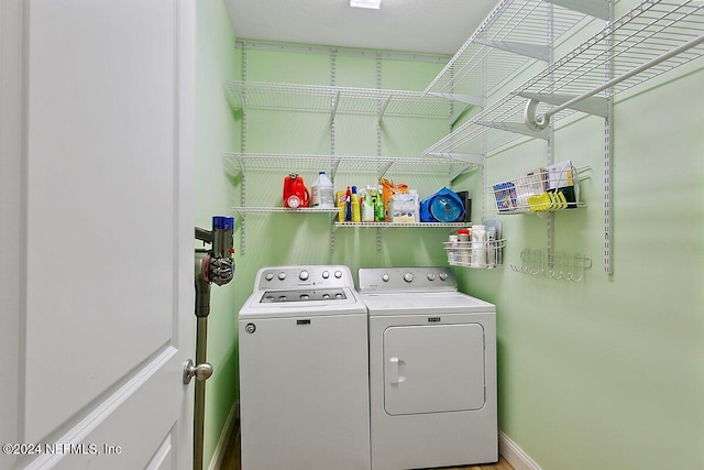 washroom featuring washing machine and dryer