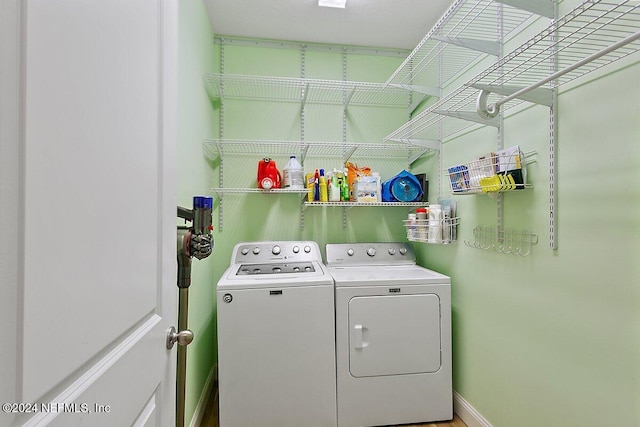 136 Pescado Dr, Saint Augustine, FL 32095 - laundry room with washing machine and dryer and baseboards