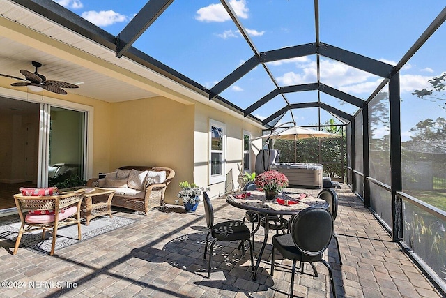 sunroom with lofted ceiling and ceiling fan