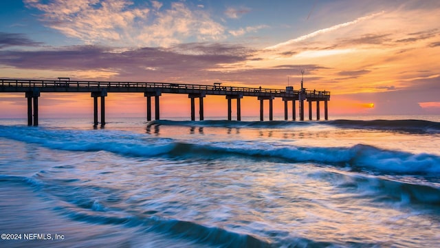 view of dock featuring a pier and a water view