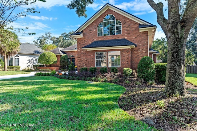 view of property featuring a front yard