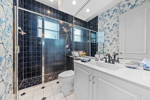 bathroom with walk in shower, vanity, tile patterned floors, and toilet