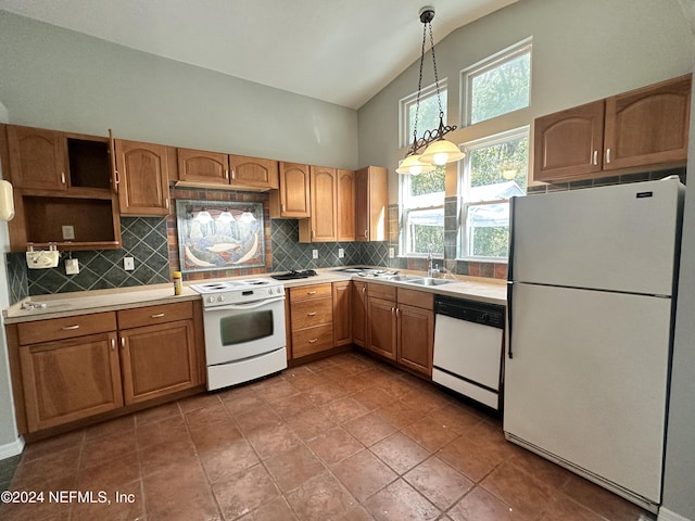 kitchen with light countertops, high vaulted ceiling, decorative backsplash, and white appliances
