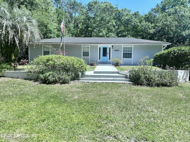 ranch-style home with a front yard