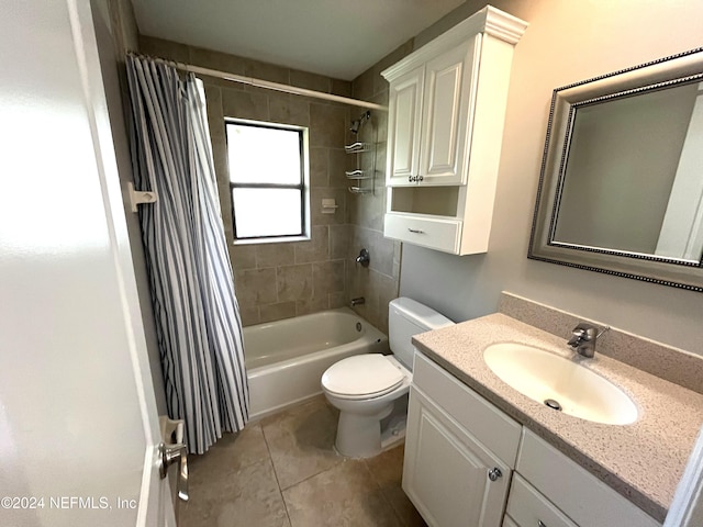 full bathroom with vanity, toilet, shower / bath combo with shower curtain, and tile patterned flooring