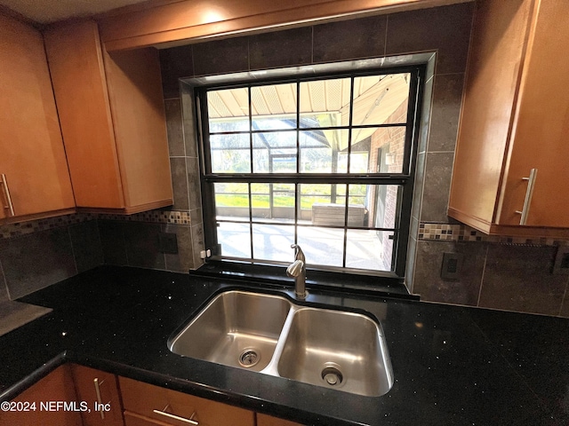 kitchen featuring sink and backsplash