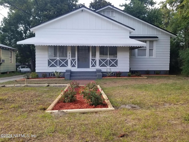 bungalow with a front yard