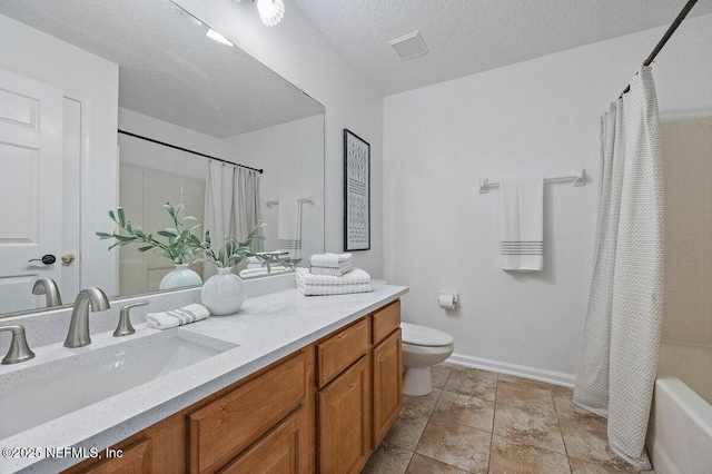 full bathroom with vanity, shower / bath combo, a textured ceiling, and toilet