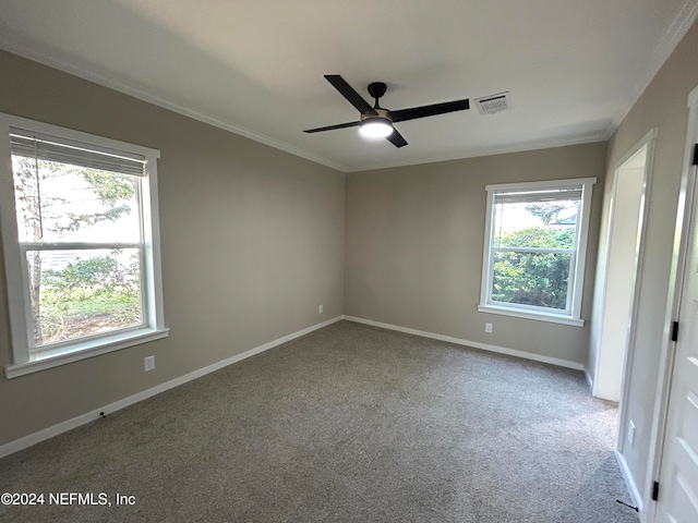 unfurnished room with crown molding, carpet flooring, and ceiling fan