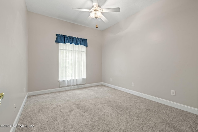 unfurnished room featuring carpet floors and ceiling fan