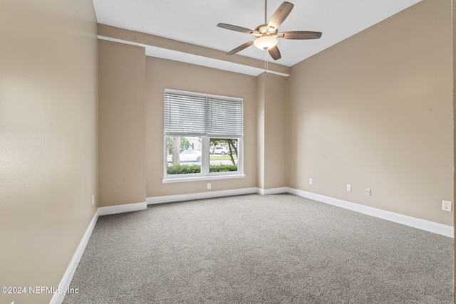 unfurnished room featuring carpet floors and ceiling fan