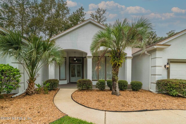 doorway to property featuring a garage