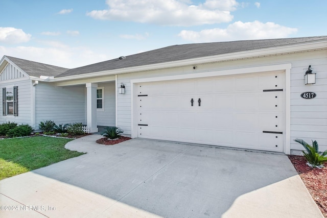 ranch-style house featuring a garage