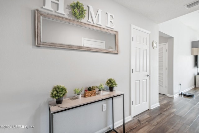 hallway featuring dark hardwood / wood-style floors