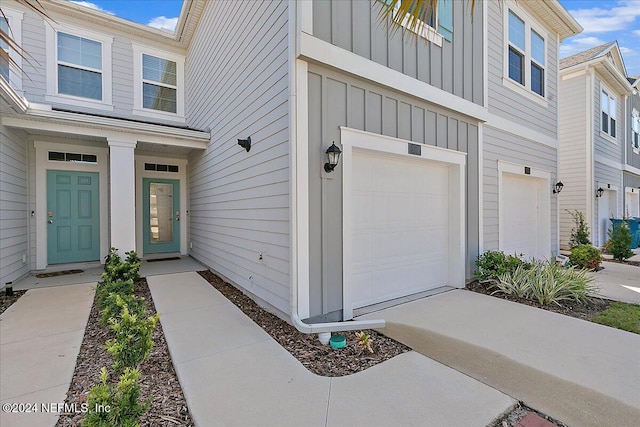 view of exterior entry featuring a garage