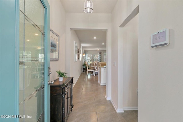 corridor with light tile patterned flooring