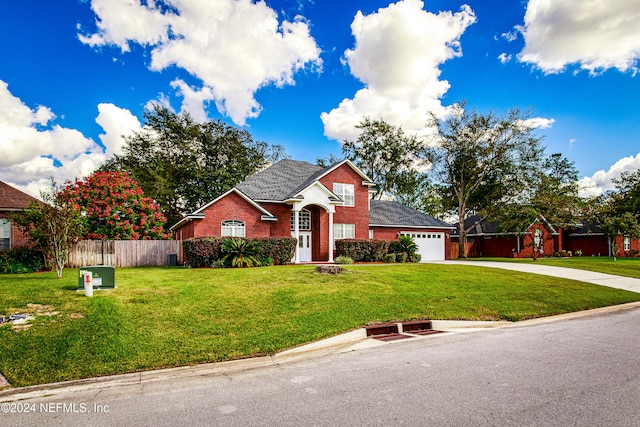 view of front facade with a front lawn and a garage