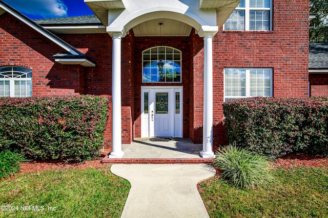 property entrance featuring french doors